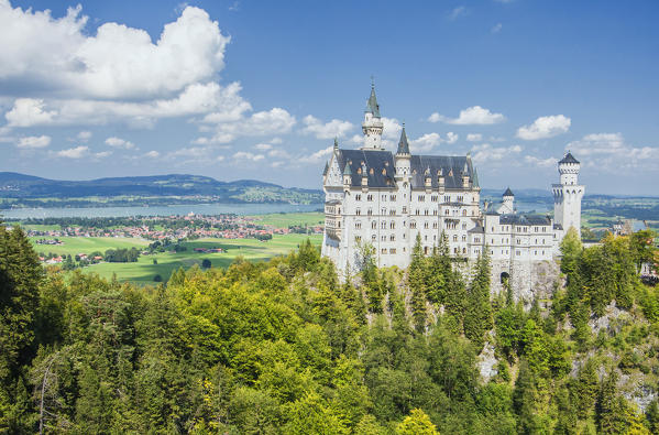 Neuschwanstein castle surrounded by woods Fussen  Bavaria southern Germany Europe