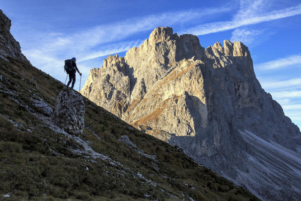 Hiker admires the rocky peaks Furcella De Furcia Odle Funes Valley South Tyrol Dolomites Trentino Alto Adige Italy Europe