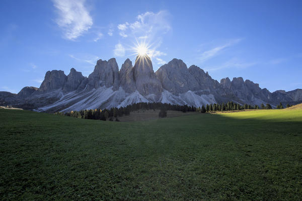 The sun on the Odle lights the green Glatsch Alm Funes Valley South Tyrol Dolomites Trentino Alto Adige Italy Europe