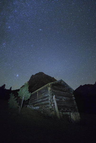 Starry night above the wooden hut Passo Delle Erbe Odle Dolomites Funes Valley Trentino Alto Adige South Tyrol Italy Europe