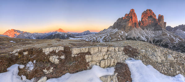 Pink sky at sunrise frames the Three Peaks of Lavaredo Dolomites Auronzo of Cadore Veneto Italy Europe