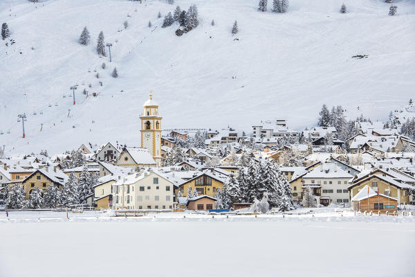 Bell tower and skilifts in Celerina Canton of Grisons Engadine Switzerland Europe