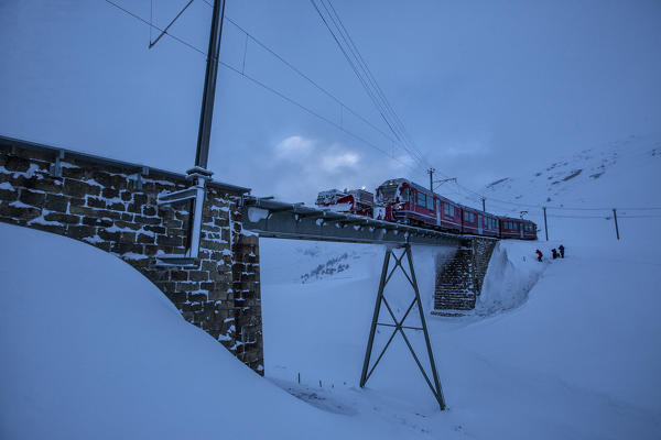 Bernina Express train at Bernina Pass Canton of Grisons Switzerland Europe