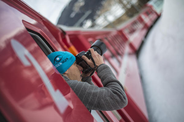 Photographer in action on Bernina Express Canton of Grisons Switzerland Europe