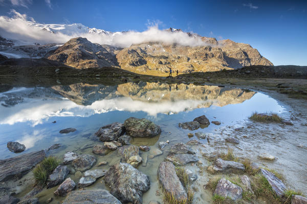 Sunrise reflections at Lake Rosole Forni Valley  Valfurva Valtellina Lombardy Italy Europe