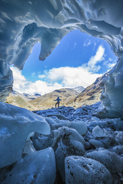 Hiker inside Forni Glacier Forni Valley Stelvio National Park Valfurva Valtellina Lombardy Italy Europe
