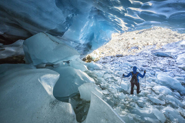 Hiker inside Forni Glacier Forni Valley Stelvio National Park Valfurva Valtellina Lombardy Italy Europe