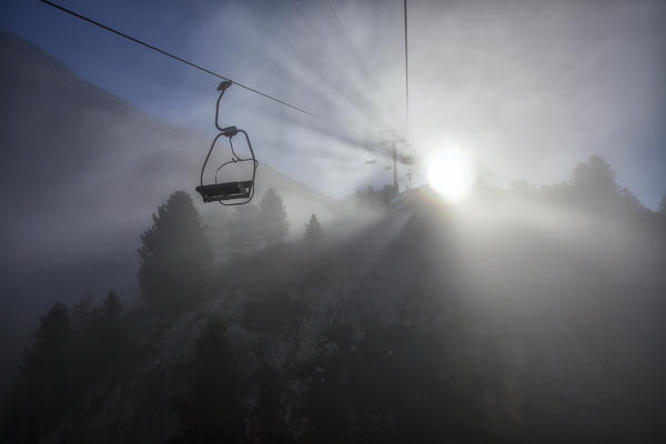 Chairlift in the fog Languard Valley Engadine Canton of Grisons Switzerland Europe