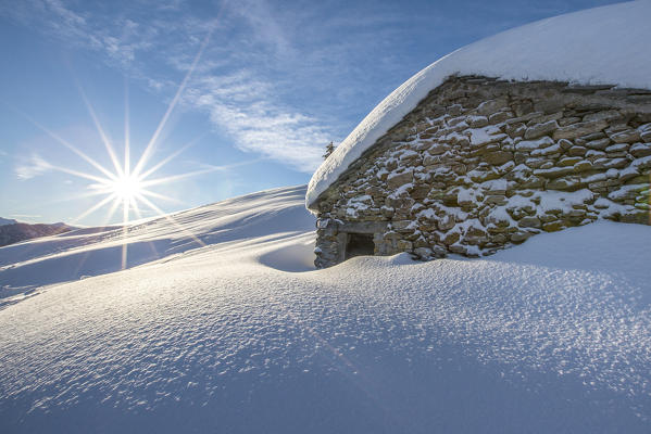 Snow covered hut after a heavy snowfall Motta di Olano Gerola Valley Valtellina Orobie Alps Lombardy Italy Europe