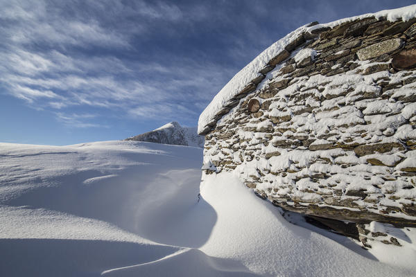 Snow covered hut after a heavy snowfall Motta di Olano Gerola Valley Valtellina Orobie Alps Lombardy Italy Europe
