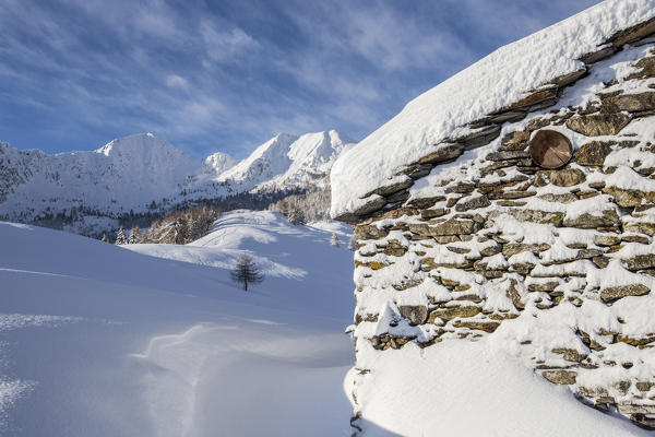 Snow covered hut after a heavy snowfall Motta di Olano Gerola Valley Valtellina Orobie Alps Lombardy Italy Europe