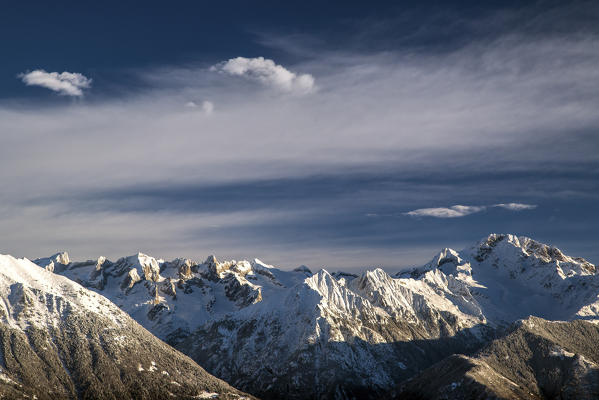 Clouds above snowy peaks and Mount Disgrazia in the background Olano Gerola Valley Valtellina Rhaetian Alps Lombardy Italy Europe