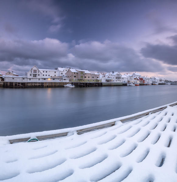 The typical fishing village of Henningsvaer surrounded by the cold sea Lofoten Islands Northern Norway Europe