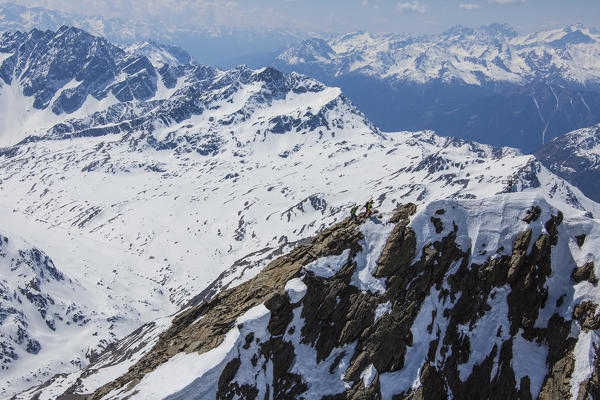 Aerial view of Forni Glacier and alpine skiers on Peak Dosegu Valtellina Valfurva Lombardy Italy Europe