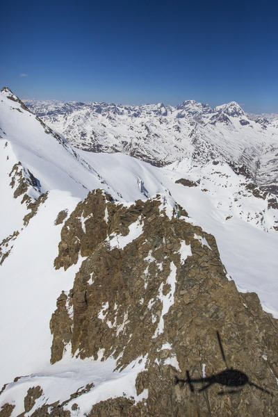 Aerial view of Forni Glacier and alpine skiers on Peak Dosegu Valtellina Valfurva Lombardy Italy Europe