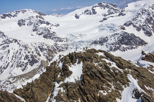 Aerial view of Forni Glacier and alpine skiers on Peak Dosegu Valtellina Valfurva Lombardy Italy Europe