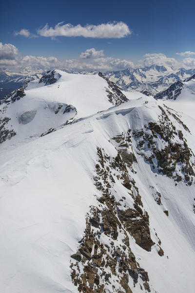 Aerial view of Forni Glacier and alpine skiers on Palon de la Mare and Mount Vioz Valtellina Lombardy Italy Europe