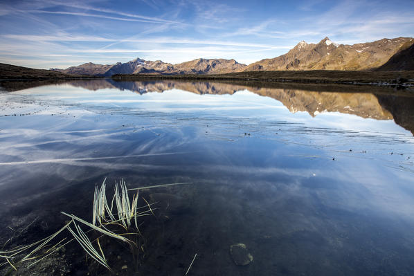 Autumnal view of Lake Andossi at sunrise Chiavenna Valley Spluga Valley Valtellina Lombardy Italy Europe