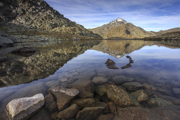 Peak Tambò reflected in Lake Bergsee at dawn Chiavenna Valley Spluga Valley Switzerland Europe