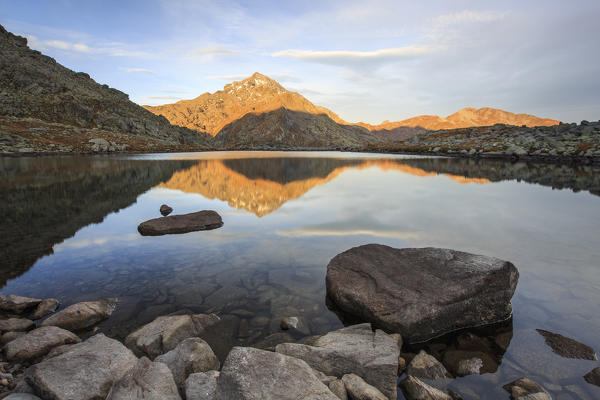 Peak Tambò reflected in Lake Bergsee at dawn Chiavenna Valley Spluga Valley Switzerland Europe