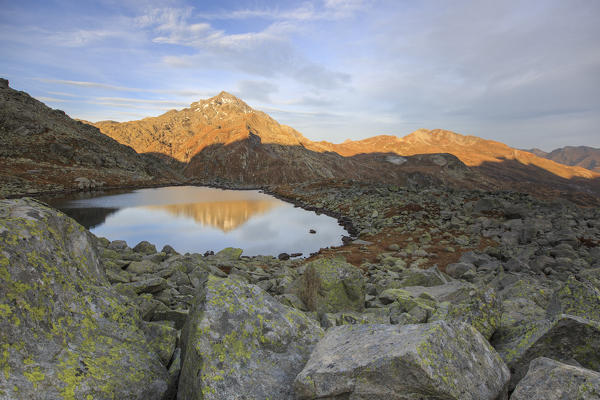 Peak Tambò reflected in Lake Bergsee at dawn Chiavenna Valley Spluga Valley Switzerland Europe