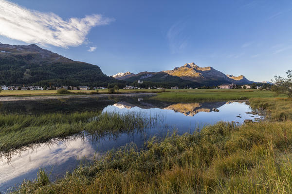 Dawn illuminates the autumn landscape and Lake Sils Engadine Canton of Graubünden Switzerland Europe