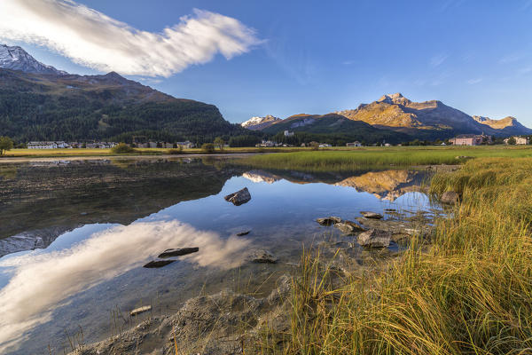 Dawn illuminates the autumn landscape and Lake Sils Engadine Canton of Graubünden Switzerland Europe