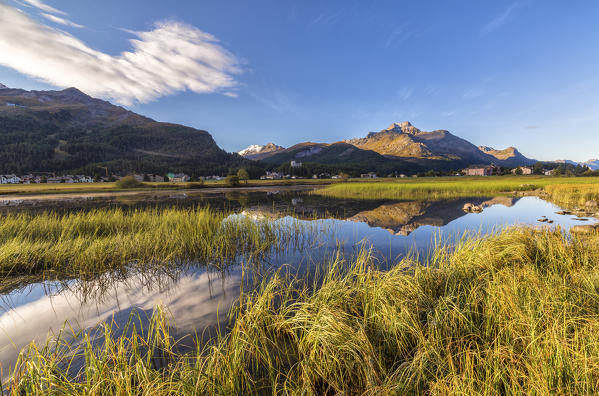 Dawn illuminates the autumn landscape and Lake Sils Engadine Canton of Graubünden Switzerland Europe