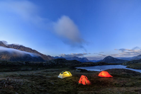 The soft lights of the tents light up dusk Minor Valley High Valtellina Livigno Lombardy Italy Europe
