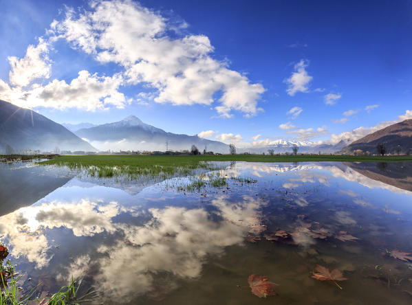 Panoramic view of Pian di Spagna flooded with Mount Legnone reflected in the water Valtellina Lombardy Italy Europe