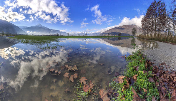 Panoramic view of Pian di Spagna flooded with Mount Legnone reflected in the water Valtellina Lombardy Italy Europe