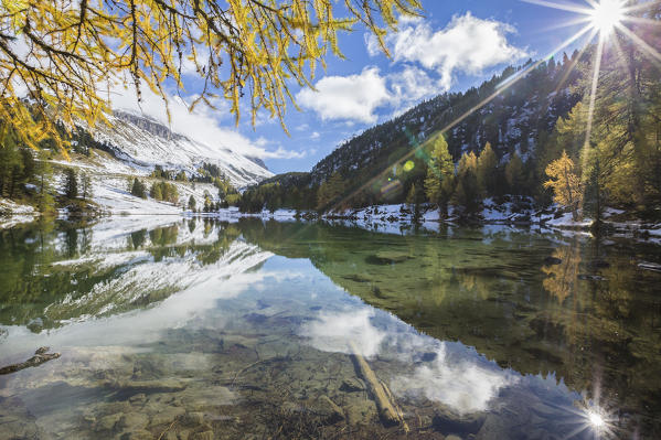 Sun shines on the clear waters of Lai da Palpuogna Albula Pass Bergün Canton of Graubünden Engadine Switzerland Europe
