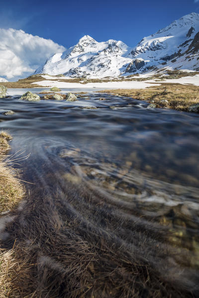 Lej Pitschen surrounded by snow capped mountains Bernina Pass Canton of Graubunden Engadine Switzerland Europe