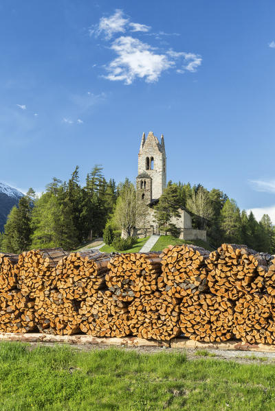 The church of San Gian surrounded by timber and snowy peaks Celerina Canton of  Graubünden Engadine Switzerland Europe