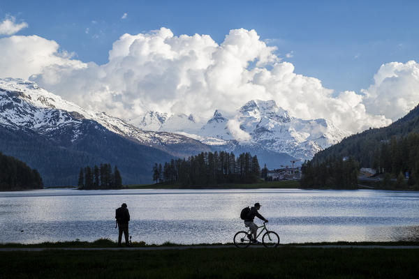 Silhouette of people on the shore of Lake Silvaplana Canton of  Graubünden Maloja Engadine Switzerland Europe