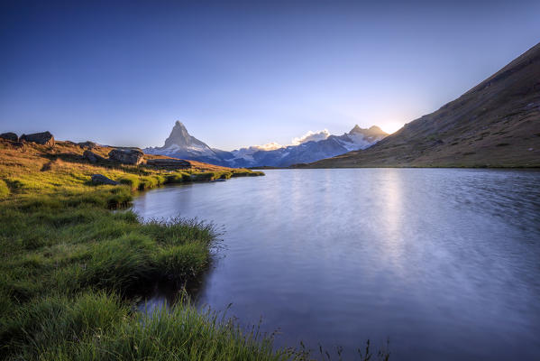 Sunset at Lake Stellisee in the background the Matterhorn Zermatt Pennine Alps Canton of Valais Switzerland Europe