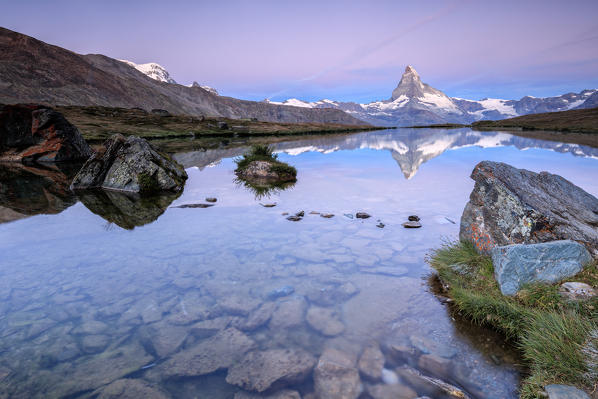 The Matterhorn reflected in Lake Stellisee at dawn Zermatt Pennine Alps Canton of Valais Switzerland Europe
