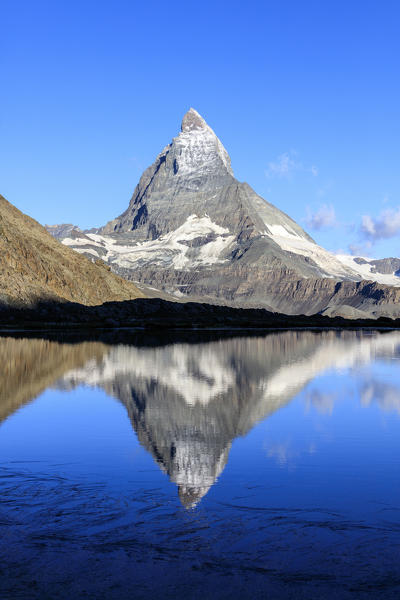 Matterhorn reflected in Lake Stellisee at dawn Zermatt Pennine Alps Canton of Valais Switzerland Europe