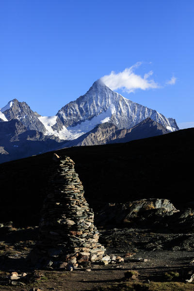 Cloud on the snowy peak of Weisshorn Zermatt Canton of Valais Pennine Alps Switzerland Europe