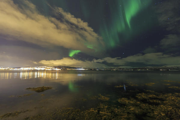 Aurora borealis on the icy landscape at Tromsø Lyngen Alps Lapland Norway Europe