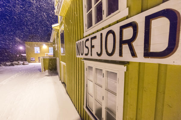 A blizzard hits the fishing village of Nusfjord at dusk Lofoten Islands Nordland County Norway Europe