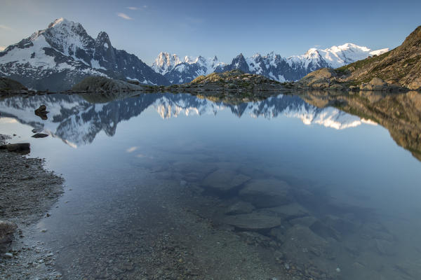 Snowy peaks of Grandes Jorasses and Mont Blanc are reflected in Lac Blanc Haute Savoie France Europe