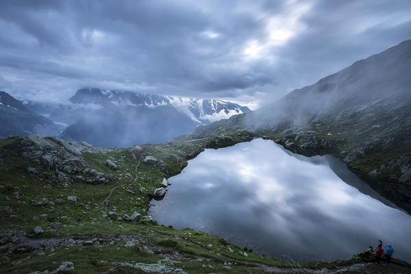 The sky is tinged with blue as the water of Lac de Cheserys  Chamonix Haute Savoie France Europe