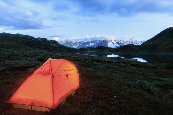 Lights of a tent around Fenetre Lakes at dusk Ferret Valley Saint Rhémy Grand St Bernard Aosta Valley Italy Europe
