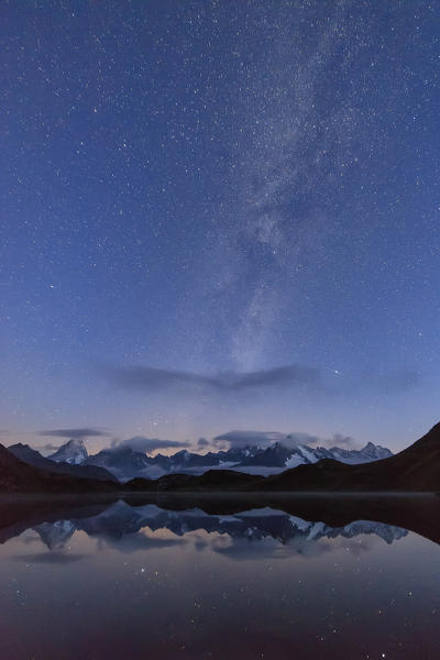 Starry summer sky on Fenetre Lakes and the high peaks Ferret Valley Saint Rhémy Grand St Bernard Aosta Valley Italy Europe