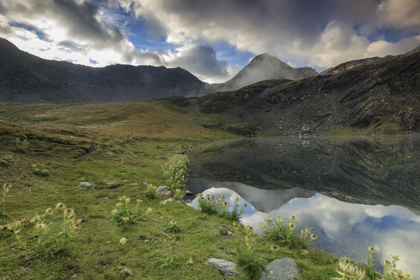 The high peaks and clouds are reflected in Fenetre Lakes Ferret Valley Saint Rhémy Grand St Bernard Aosta Valley Italy Europe