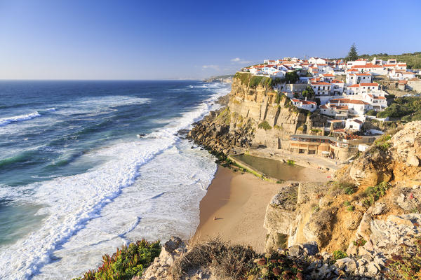 Top view of ocean waves crashing on the high cliffs of Azenhas do Mar Sintra Portugal Europe