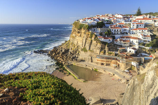 Top view of ocean waves crashing on the high cliffs of Azenhas do Mar Sintra Portugal Europe