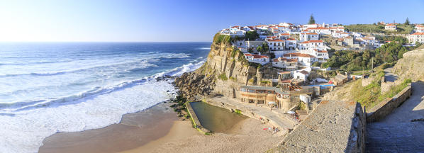 Panoramic view of ocean waves crashing on the high cliffs of Azenhas do Mar Sintra Portugal Europe