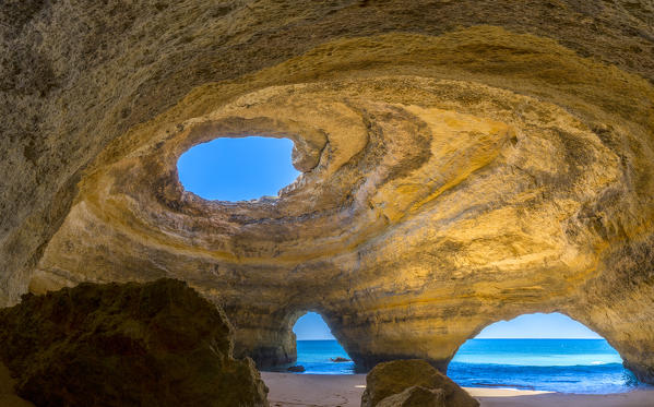 The sea caves of Benagil with natural windows on the clear waters of the Atlantic Ocean Faro District Algarve Portugal Europe